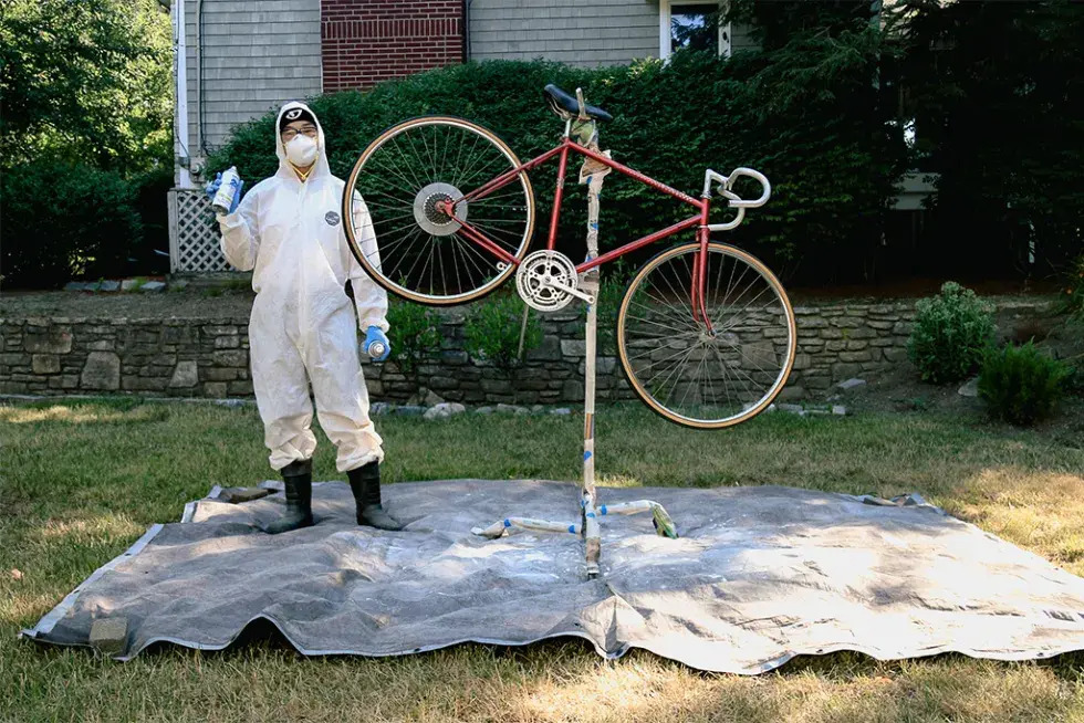 Photo of Peter Cheung with a maroon bike